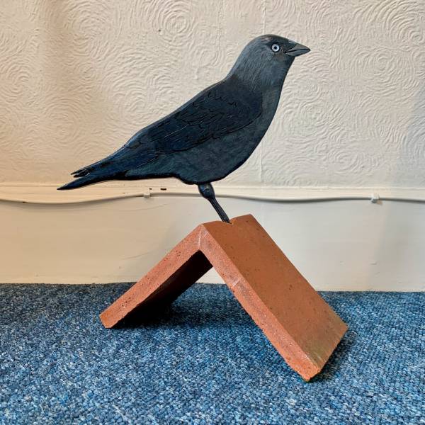 - a , wood Sculpture by John Comley, measuring 35 x 26 cm (H x W) £150